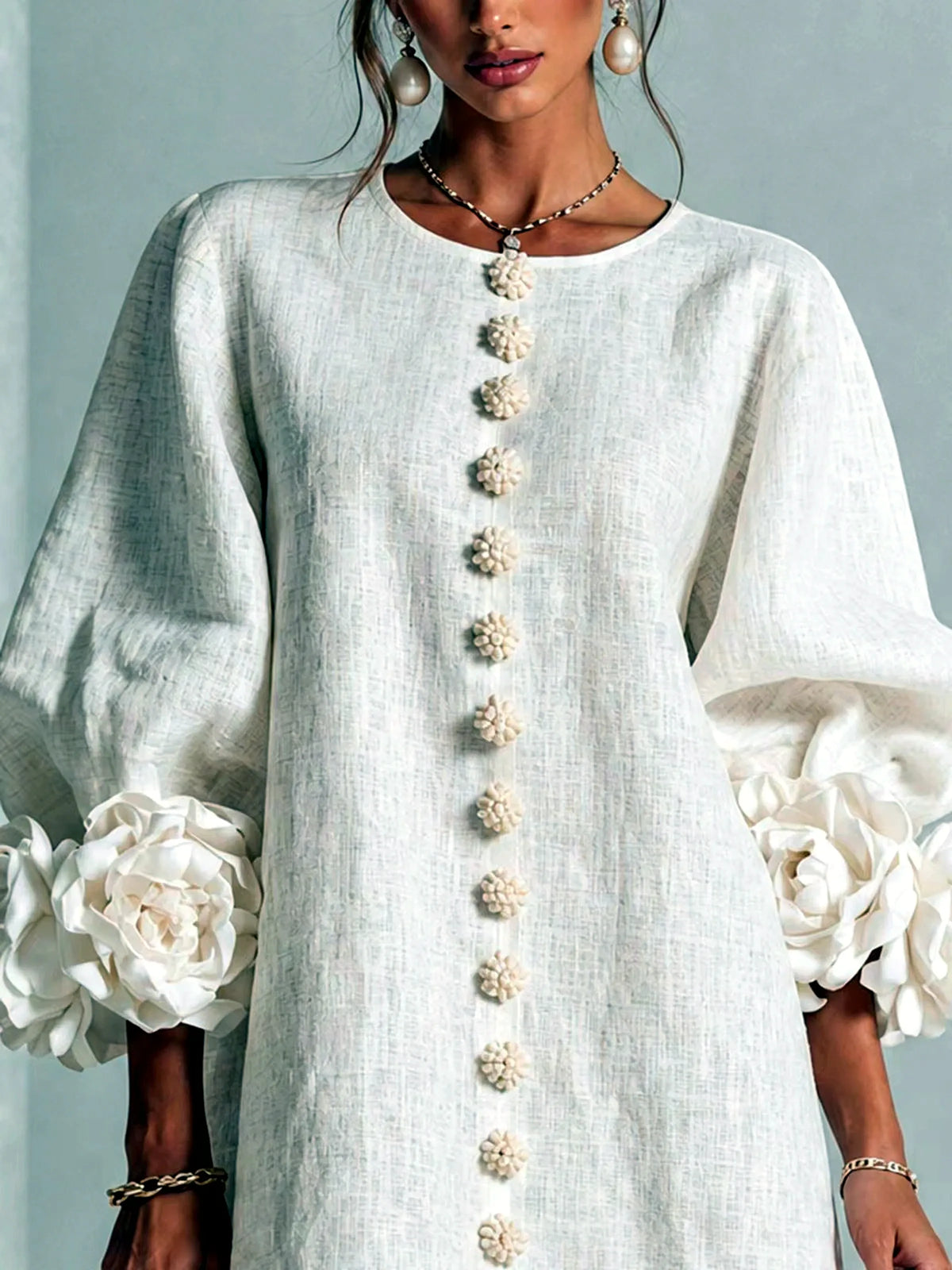 Women's floral-cuff button-front relaxed dress in ivory, bodice and cuff detail.