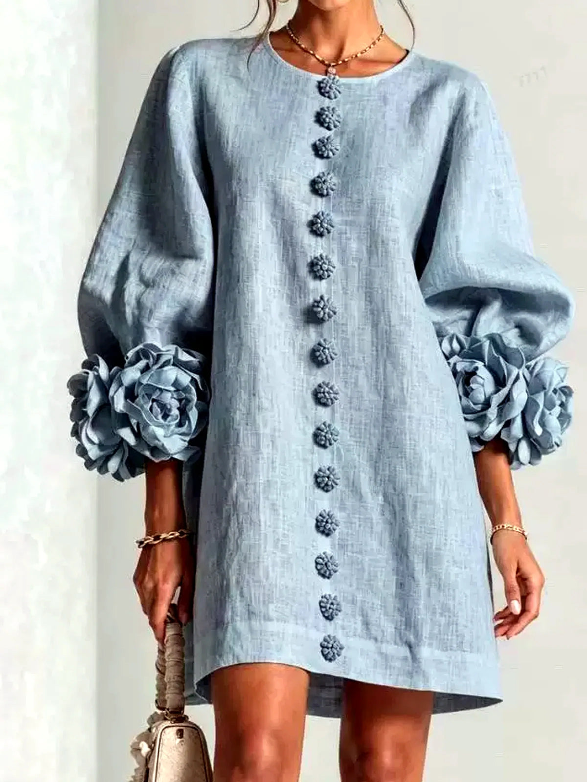 Women's floral-cuff button-front relaxed dress in light blue, front model view.