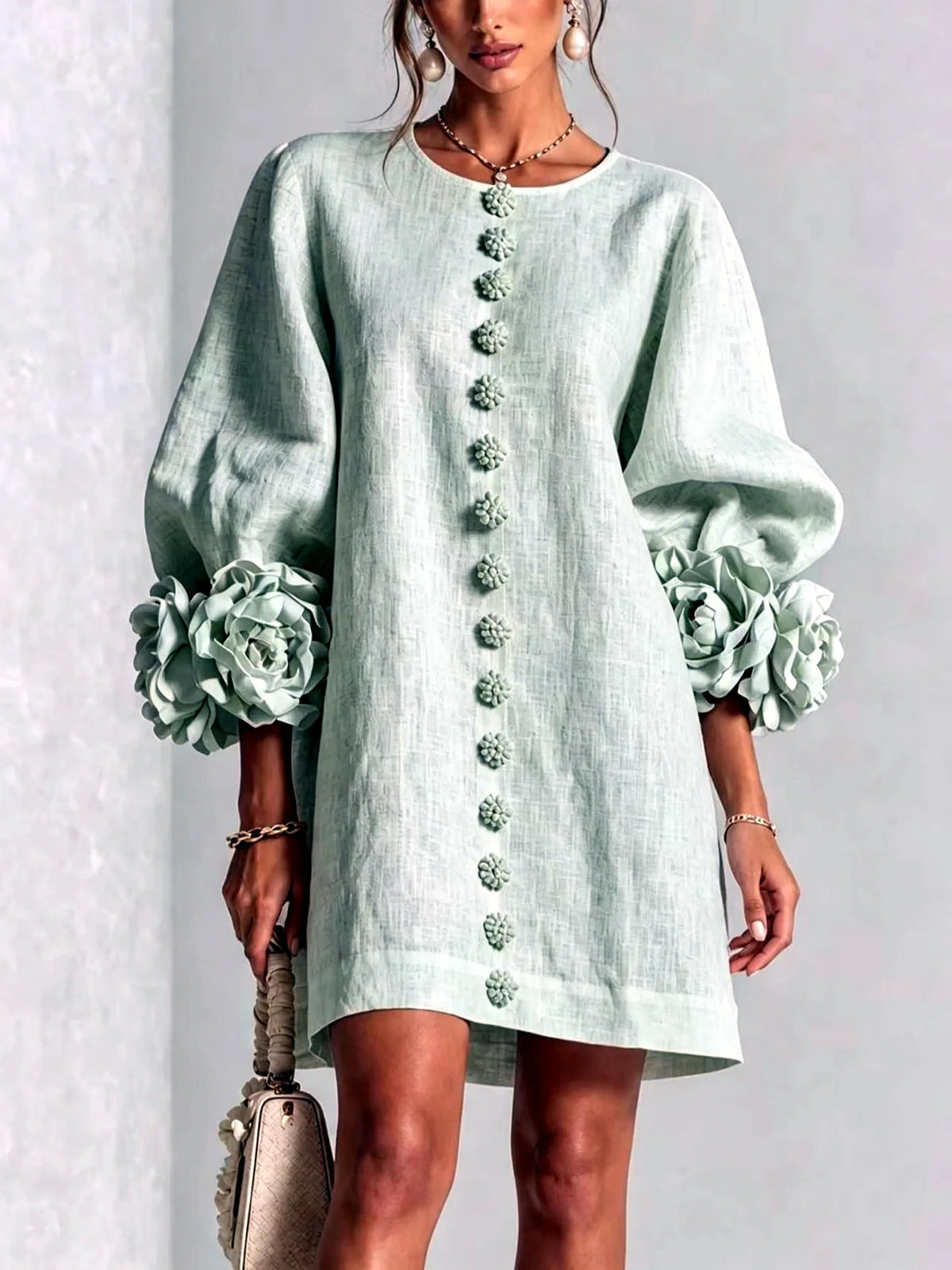 Women's floral-cuff button-front relaxed dress in mint green, front model view.