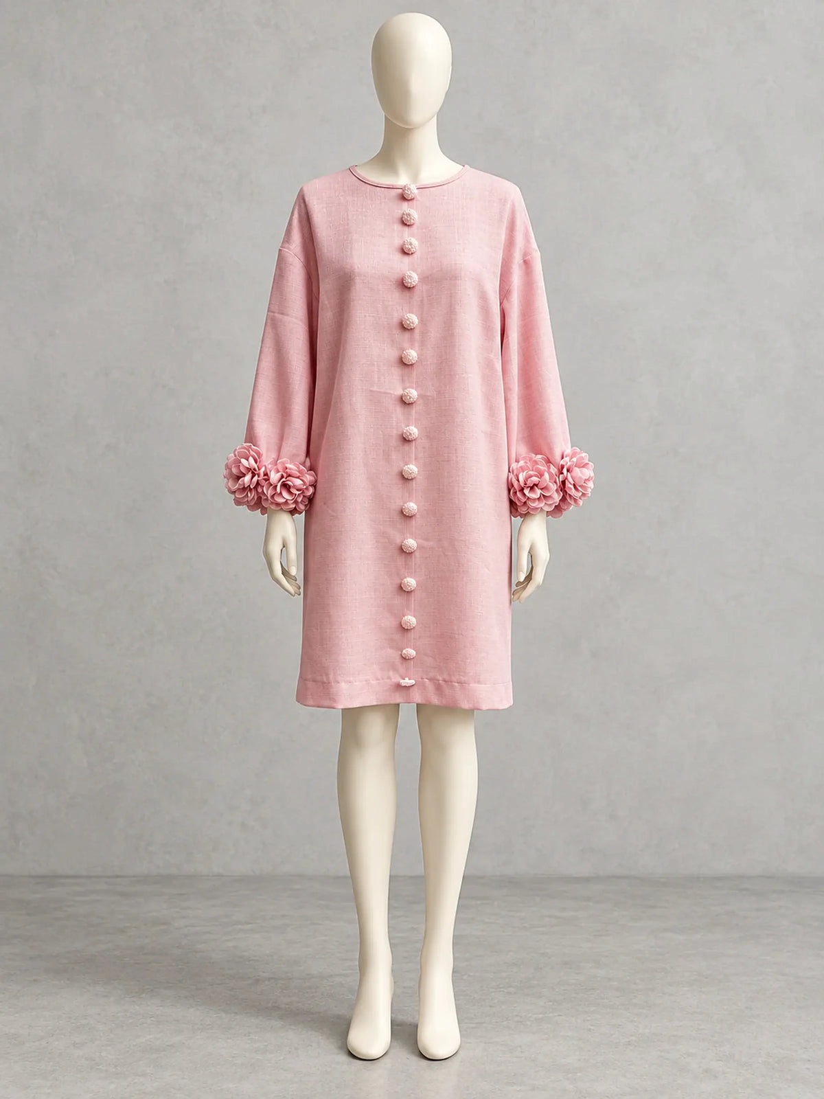 Women's floral-cuff button-front relaxed dress in pink, front mannequin view.