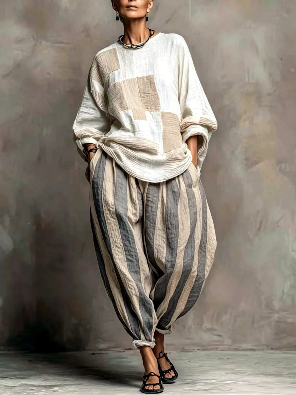 Women's patchwork top and striped relaxed pants set in ivory and beige, front model view.