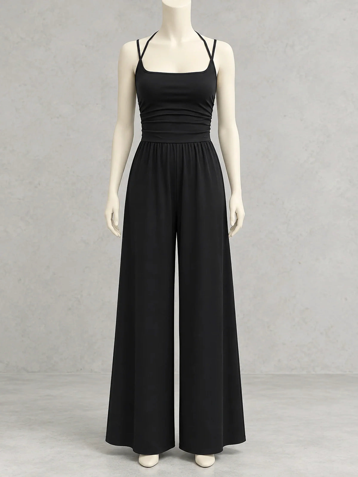 Women's sleeveless ruched-bodice wide-leg jumpsuit in black, front mannequin view.