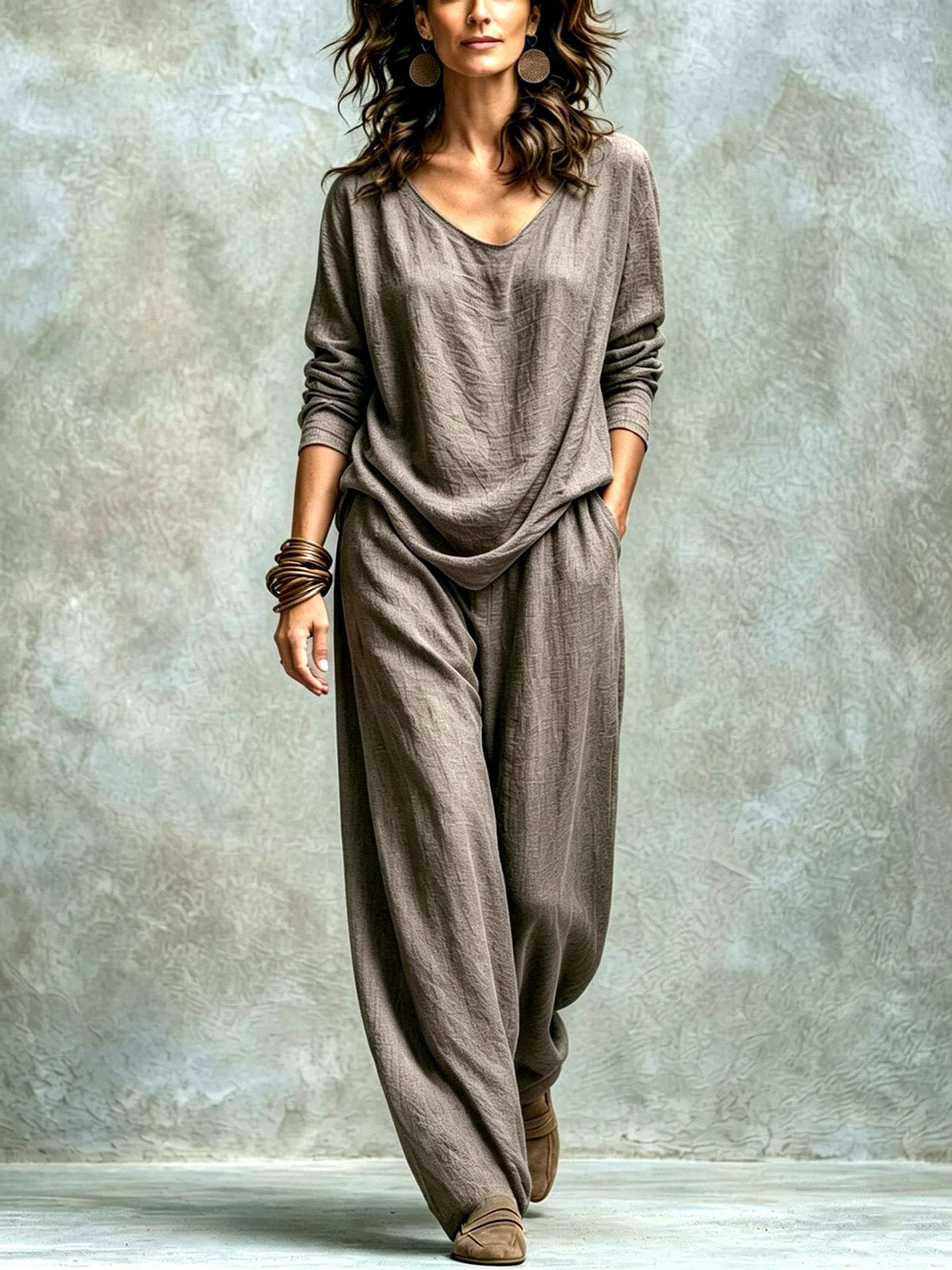Women’s taupe textured top and wide-leg pants set, showing the relaxed draped fit and natural fabric folds.