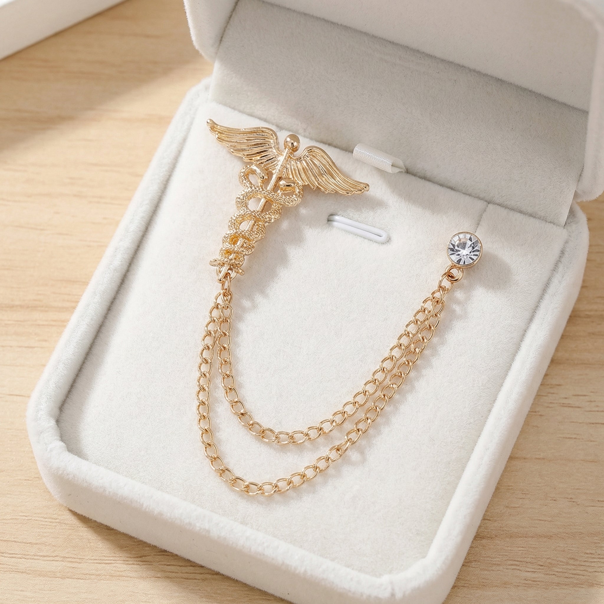 Lapel pins with chains, winged double serpent staff