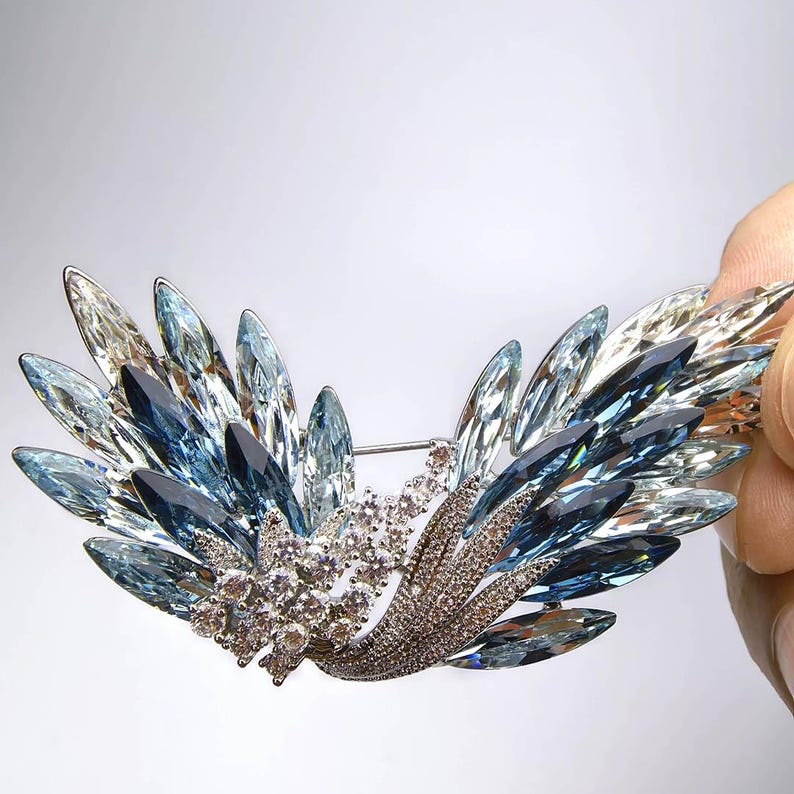 Original copper lake crystal wing brooch, blue gradient crystal inlaid with zircon