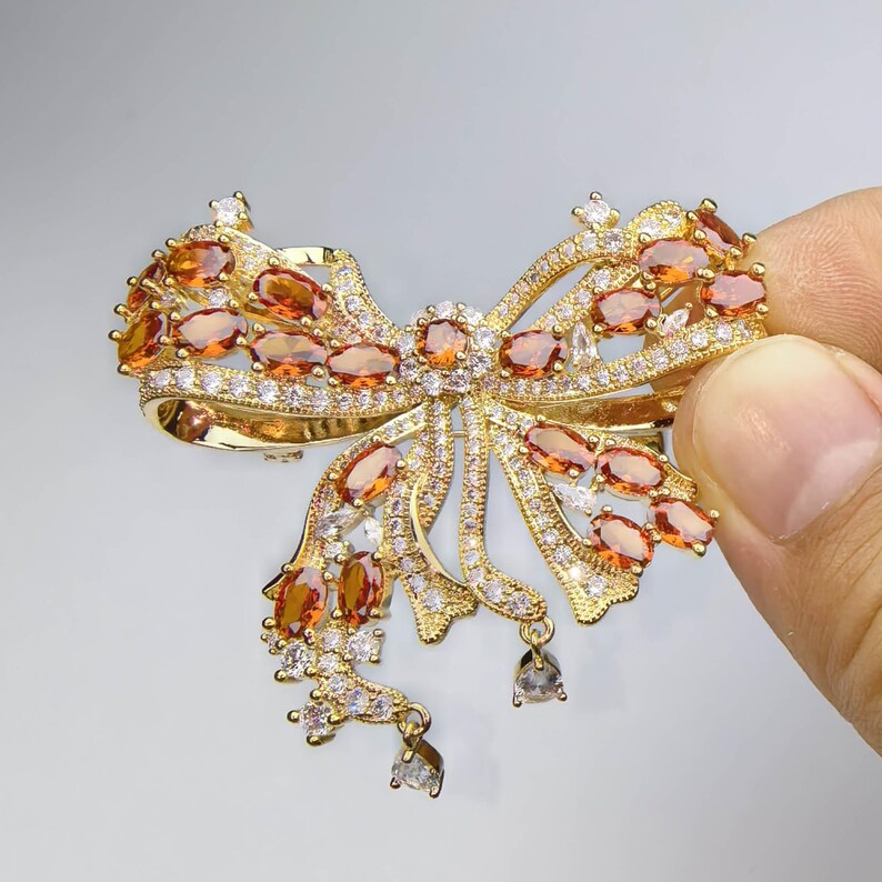 Palace French retro bow brooch inlaid with orange zircon