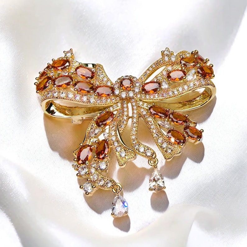 Palace French retro bow brooch inlaid with orange zircon
