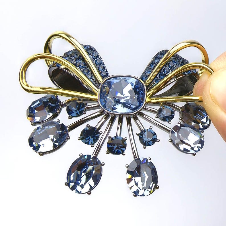 Retro palace style black bow brooch inlaid with blue zircon crystal