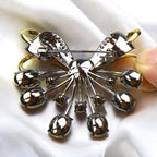 Retro palace style black bow brooch inlaid with blue zircon crystal