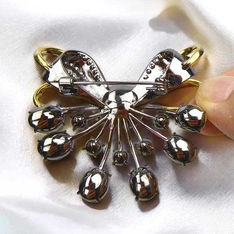 Retro palace style black bow brooch inlaid with blue zircon crystal