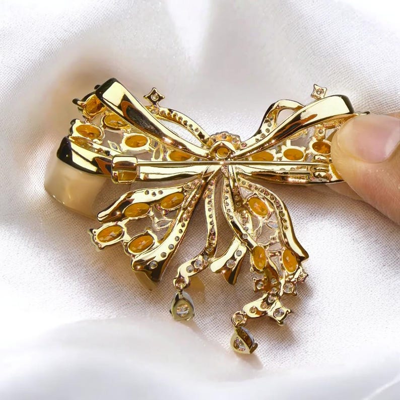 Palace French retro bow brooch inlaid with orange zircon