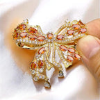 Palace French retro bow brooch inlaid with orange zircon