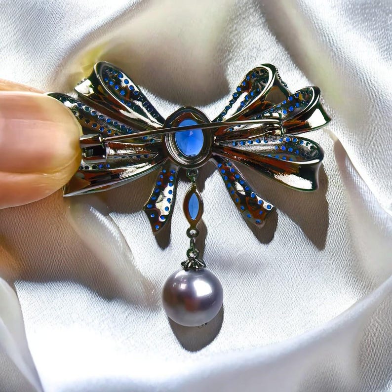 Blue Copper Bow Brooch: Zircon Pearl Pendant