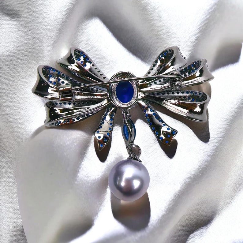 Blue Copper Bow Brooch: Zircon Pearl Pendant