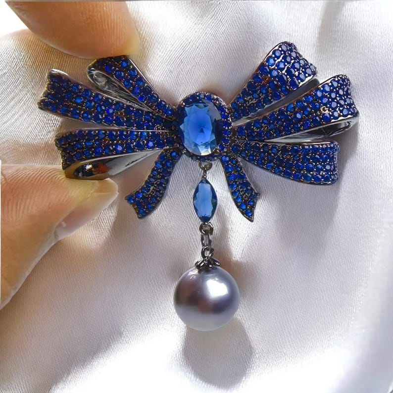 Blue Copper Bow Brooch: Zircon Pearl Pendant