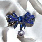 Blue Copper Bow Brooch: Zircon Pearl Pendant