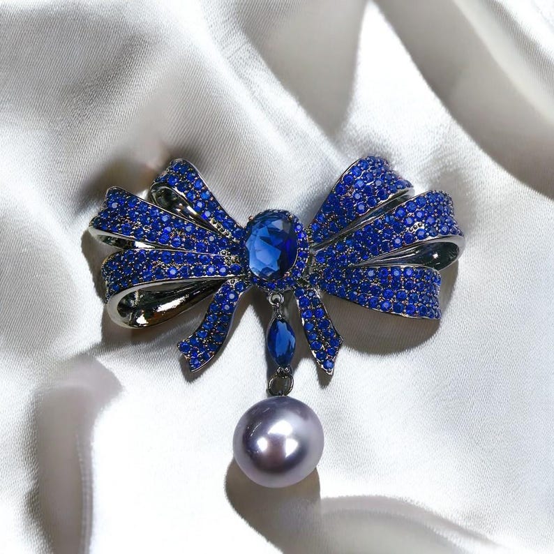 Blue Copper Bow Brooch: Zircon Pearl Pendant
