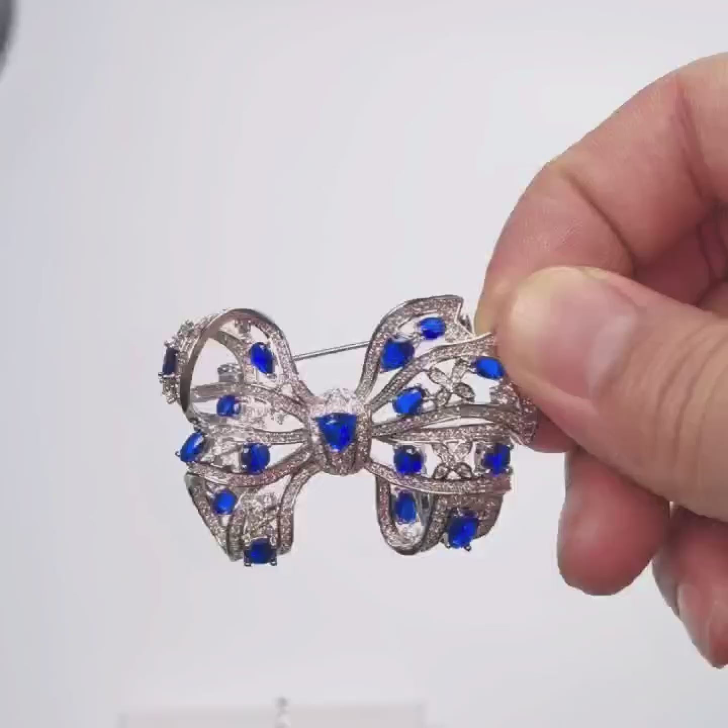 Load video: Silver Handmade Copper Inlaid Blue Crystal Bow Brooch Gift