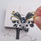 Retro palace style black bow brooch inlaid with blue zircon crystal