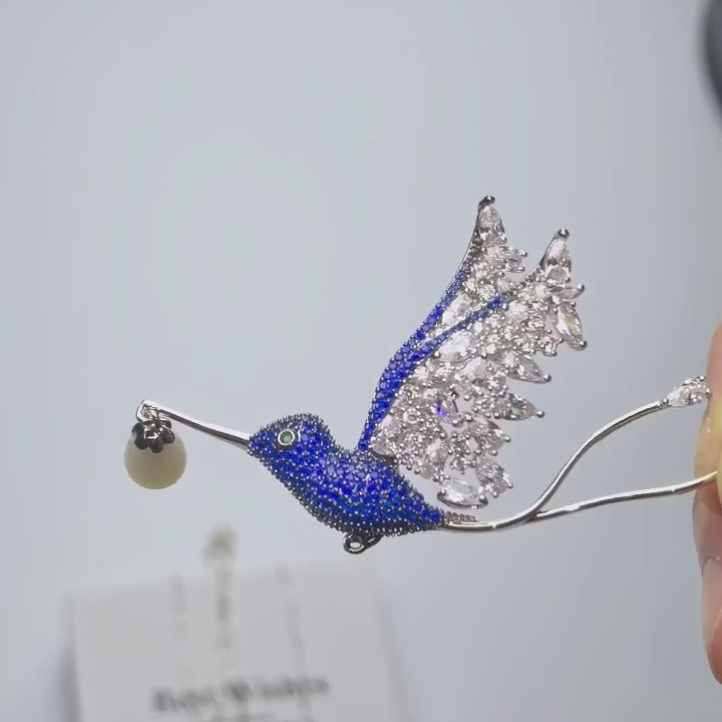 Load video: Blue Zircon Hummingbird Brooch: Copper Pearl Bird Pin