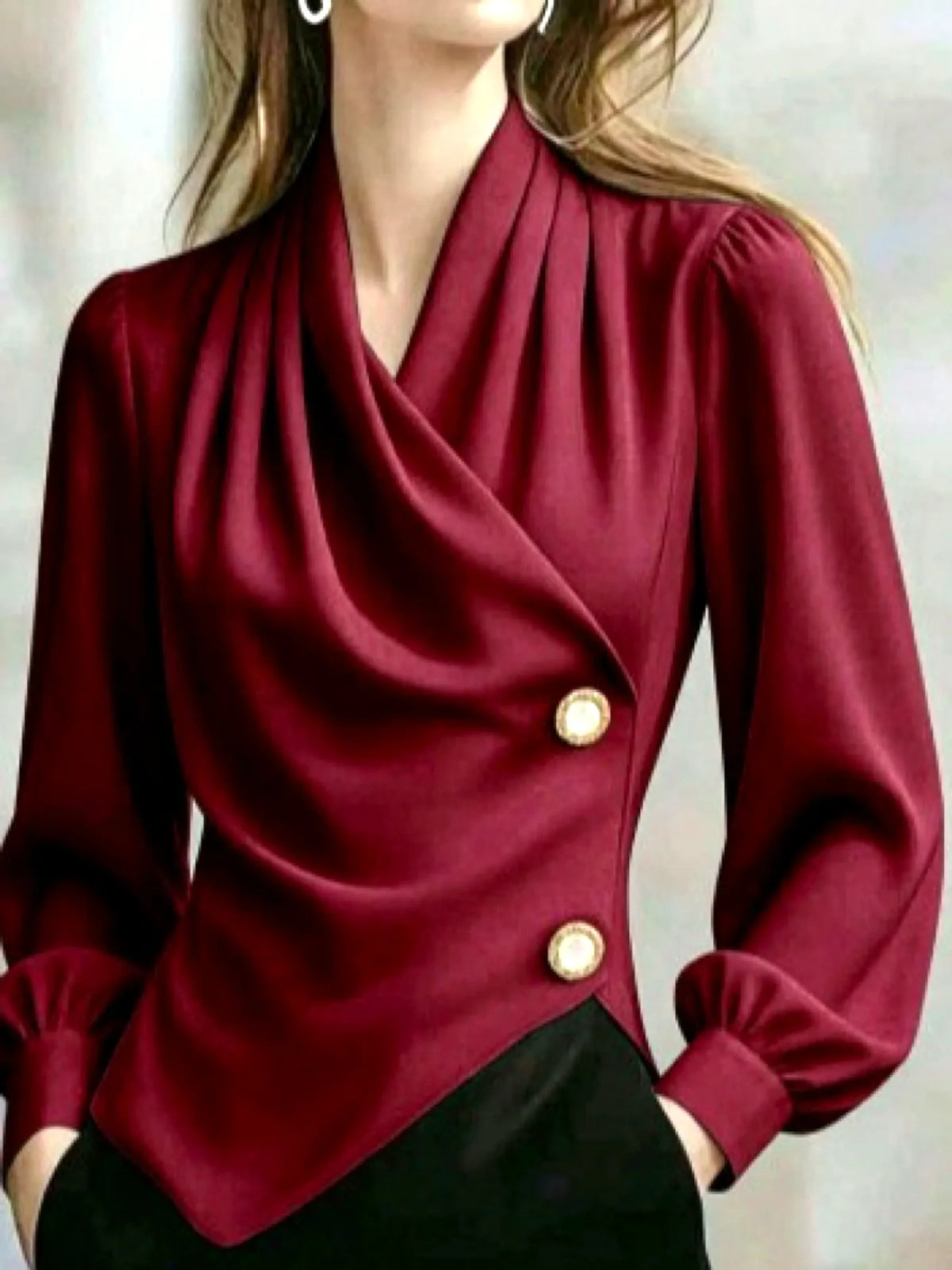 Women's draped button-front asymmetric blouse in burgundy, front model view.