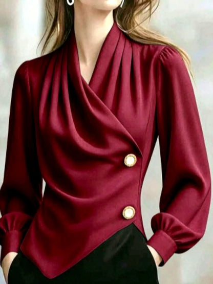 Women's draped button-front asymmetric blouse in burgundy, front model view.