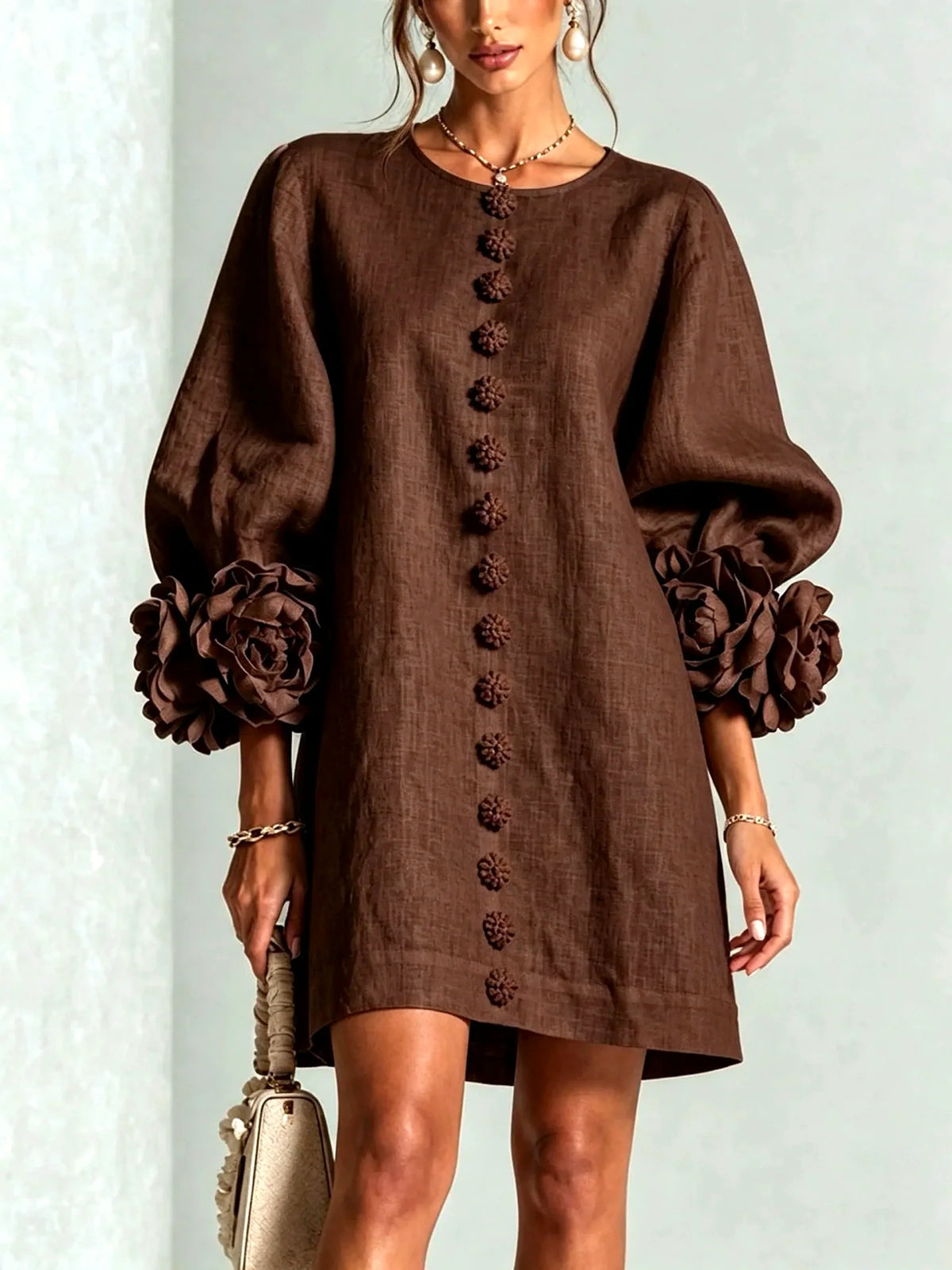 Women's floral-cuff button-front relaxed dress in brown, front model view.