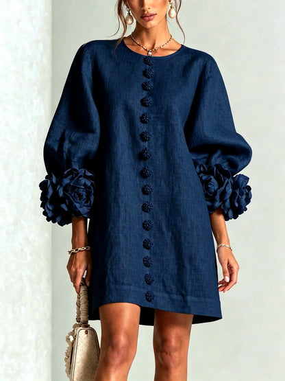 Women's floral-cuff button-front relaxed dress in navy, front model view.