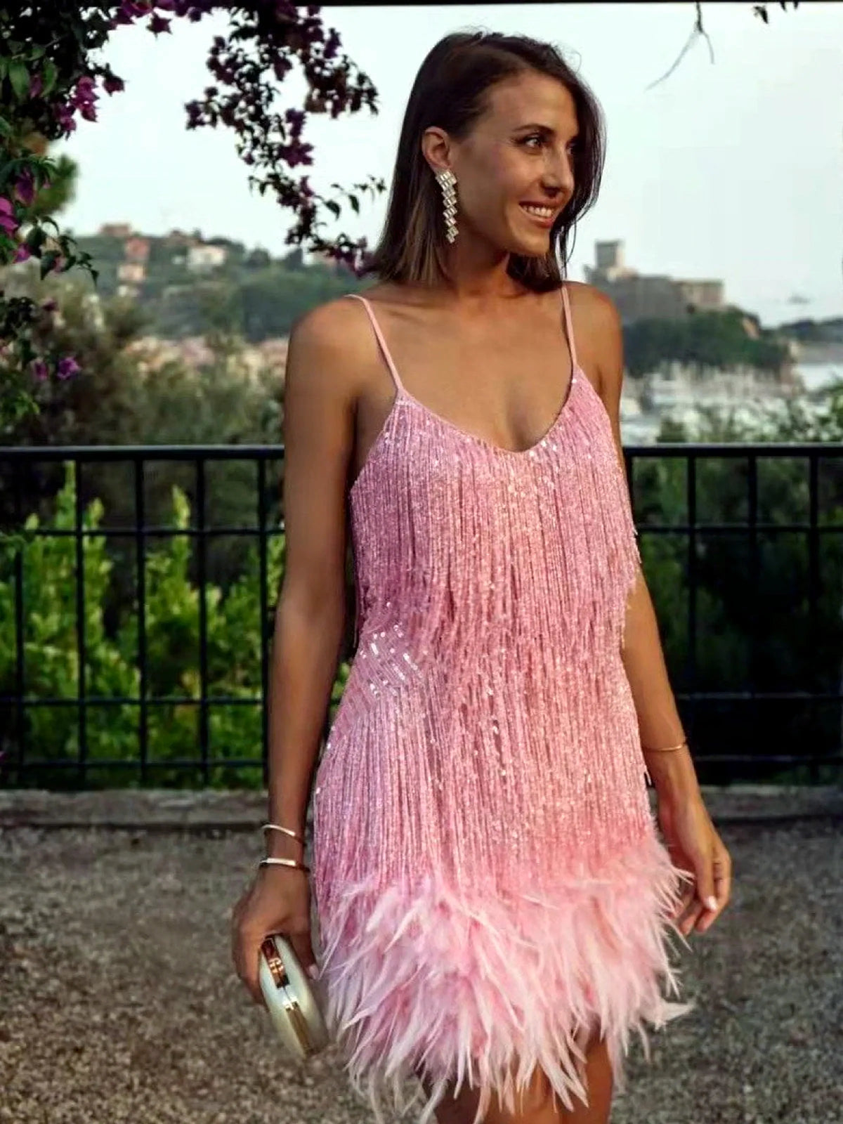 Women's fringe and feather-trim mini dress in pink, outdoor model view.