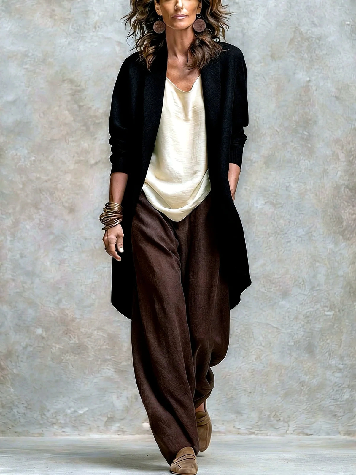 Women's linen-blend relaxed top and wide-leg pants set in black, model view with contrasting pants.