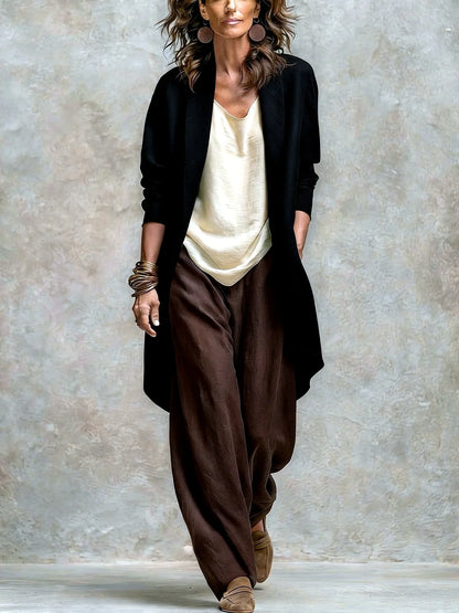 Women's linen-blend relaxed top and wide-leg pants set in black, model view with contrasting pants.
