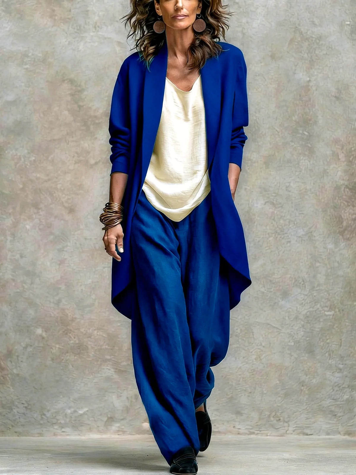 Women's linen-blend relaxed top and wide-leg pants set in blue, front model view.