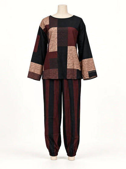 Women's patchwork top and striped relaxed pants set in black and burgundy, front mannequin view.