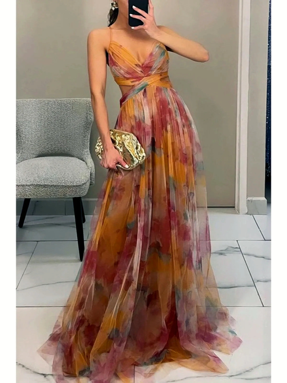 Women's printed cutout-waist maxi dress in orange multicolor, front mirror view.