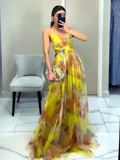Women's printed cutout-waist maxi dress in yellow multicolor, front mirror view.