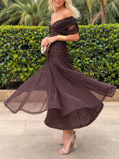 Women's ruched off-shoulder flowing dress in brown, front twirl view.