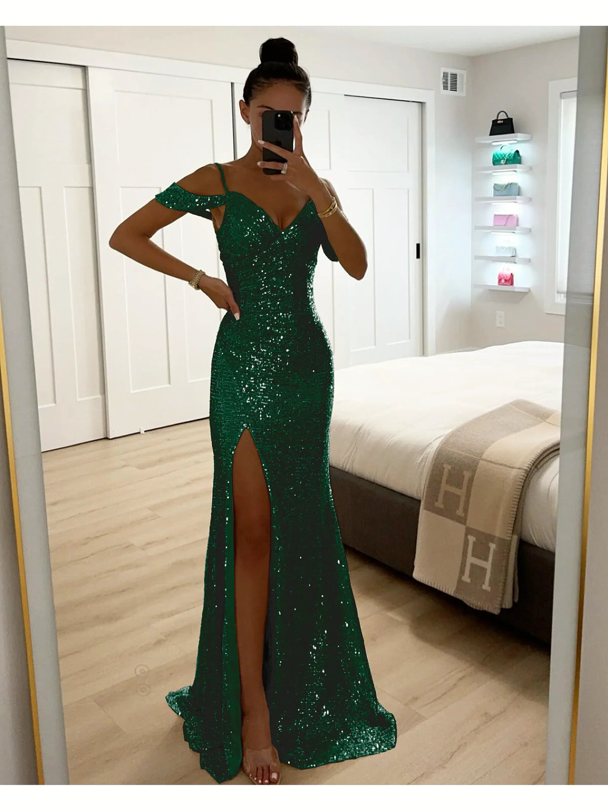 Women's sequin off-shoulder slit evening gown in green, front mirror view.