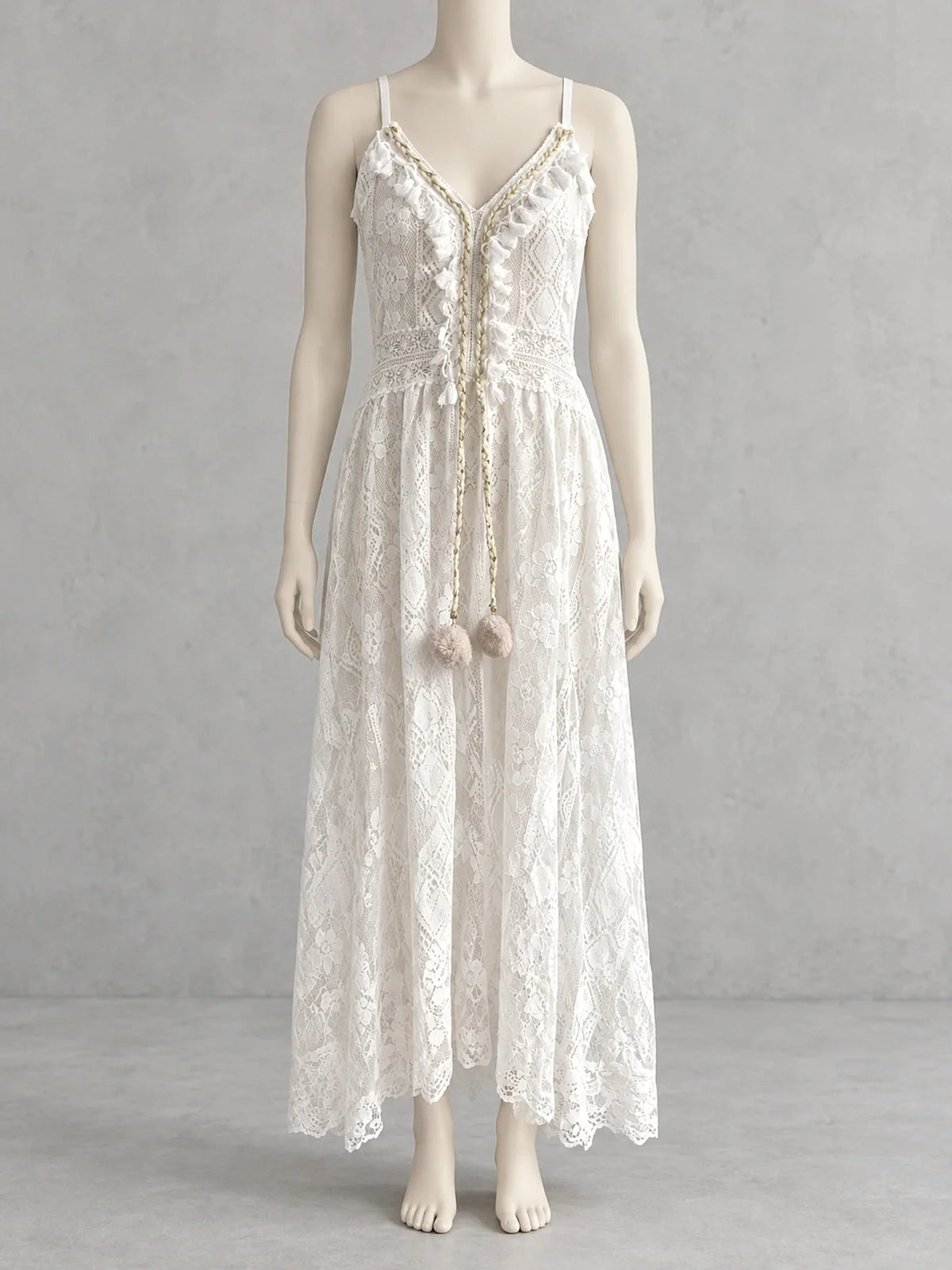 Women's sleeveless lace high-low dress in white, front mannequin view.