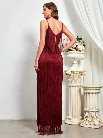 Women's sleeveless tiered fringe maxi dress in burgundy, back model view.
