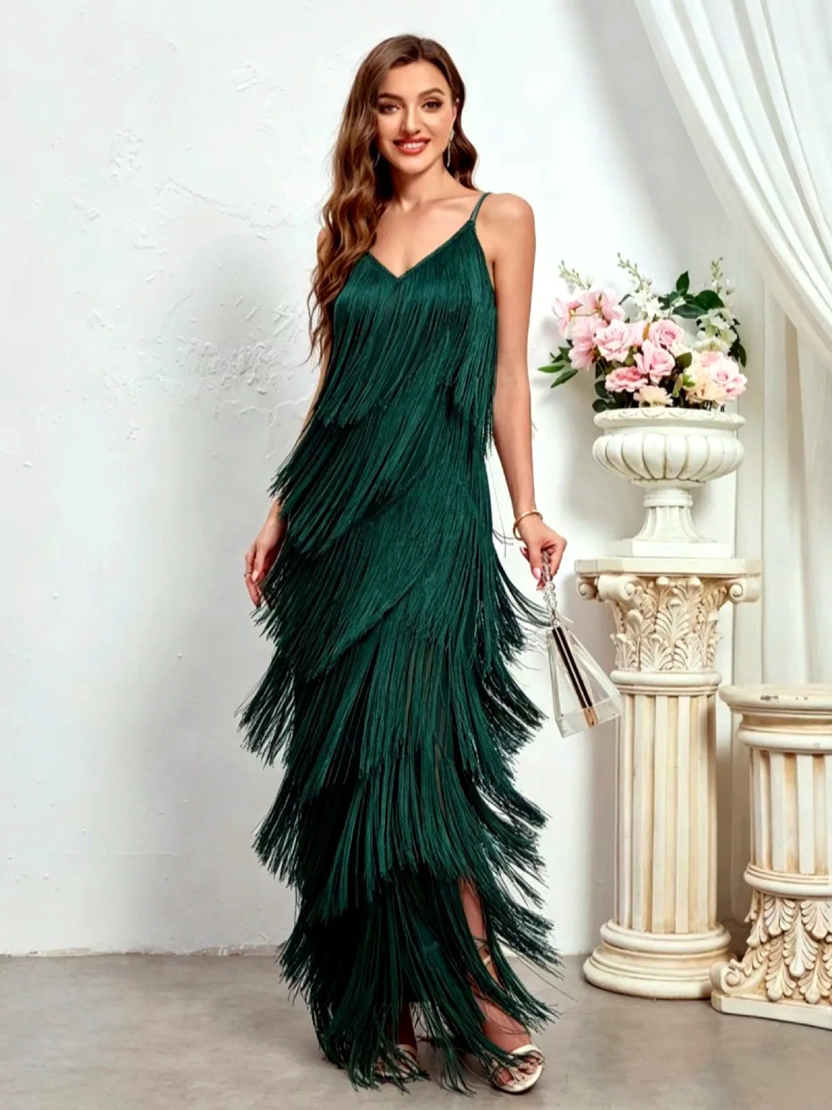 Women's sleeveless tiered fringe maxi dress in green, front model view.