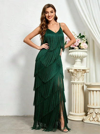 Women's sleeveless tiered fringe maxi dress in green, slit and fringe detail.