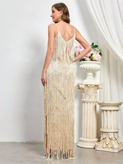 Women's sleeveless tiered fringe maxi dress in ivory, back model view.