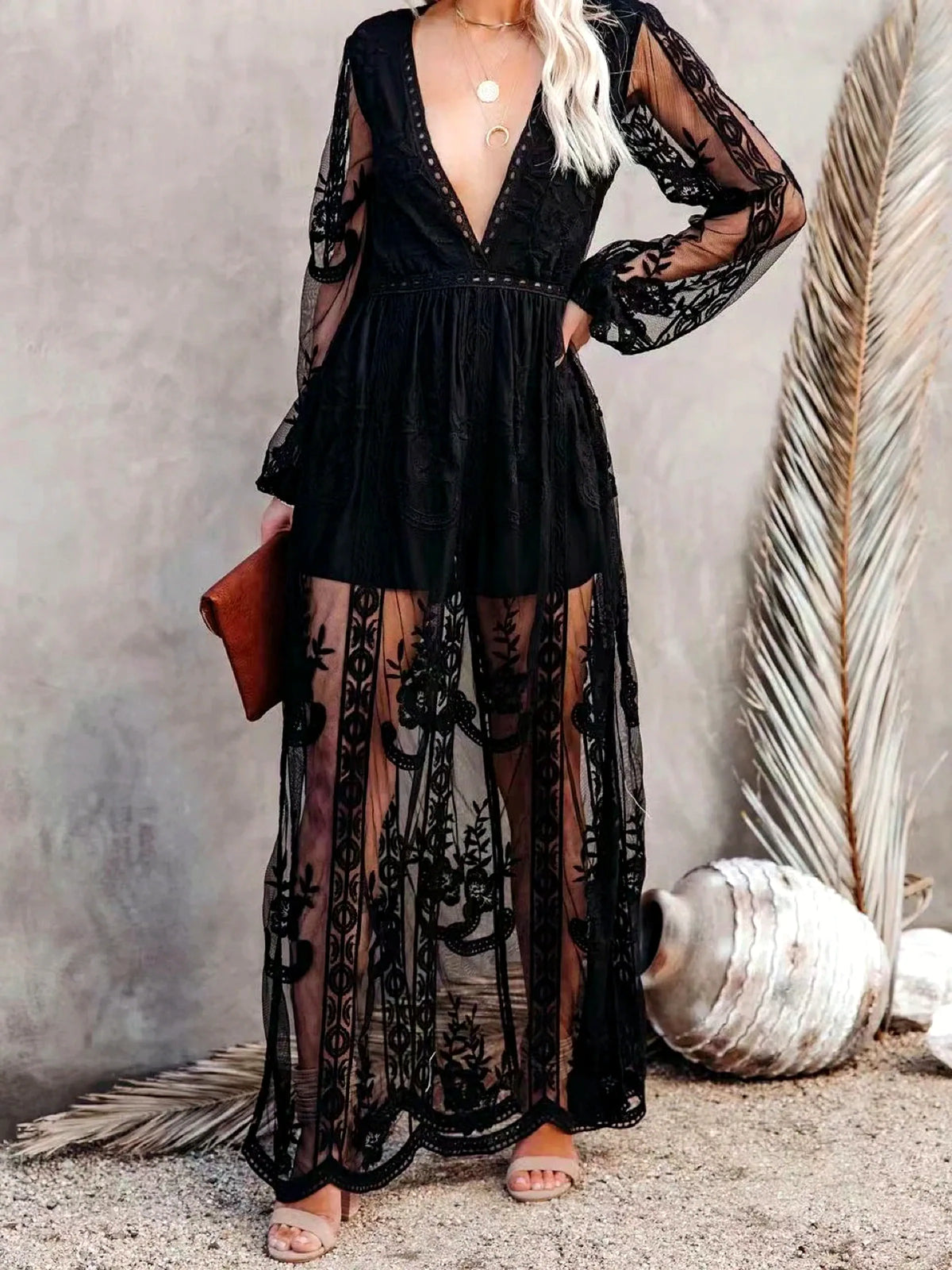 Women's V-neck long-sleeve sheer lace maxi dress in black, bodice and sleeve detail.
