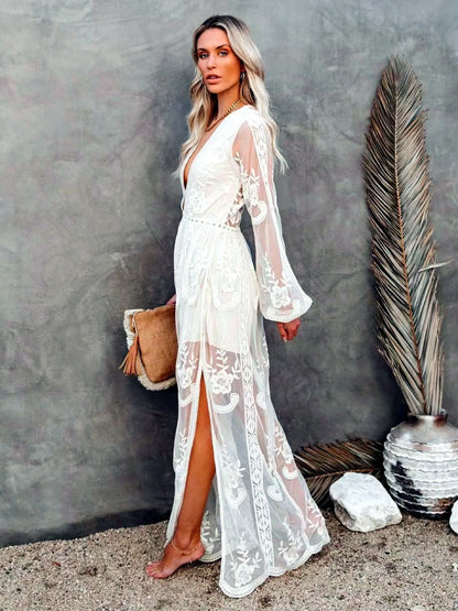Women's V-neck long-sleeve sheer lace maxi dress in white, back model view.