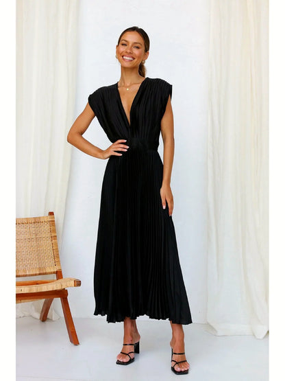 Women's V-neck pleated midi dress in black, front model view.