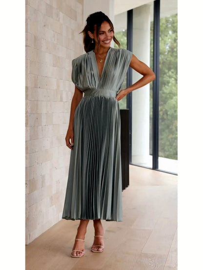Women's V-neck pleated midi dress in gray, front model view.