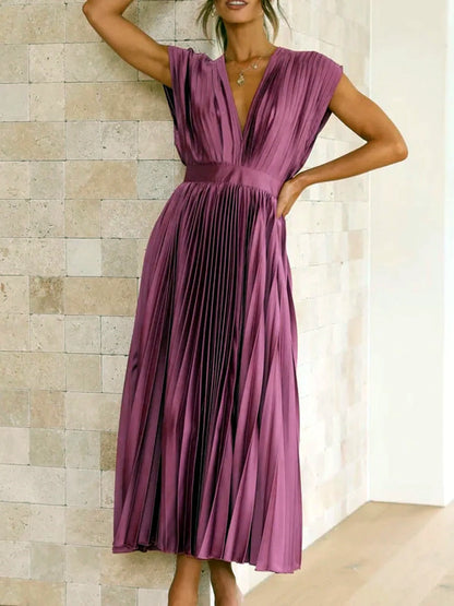 Women's V-neck pleated midi dress in purple, front model view.